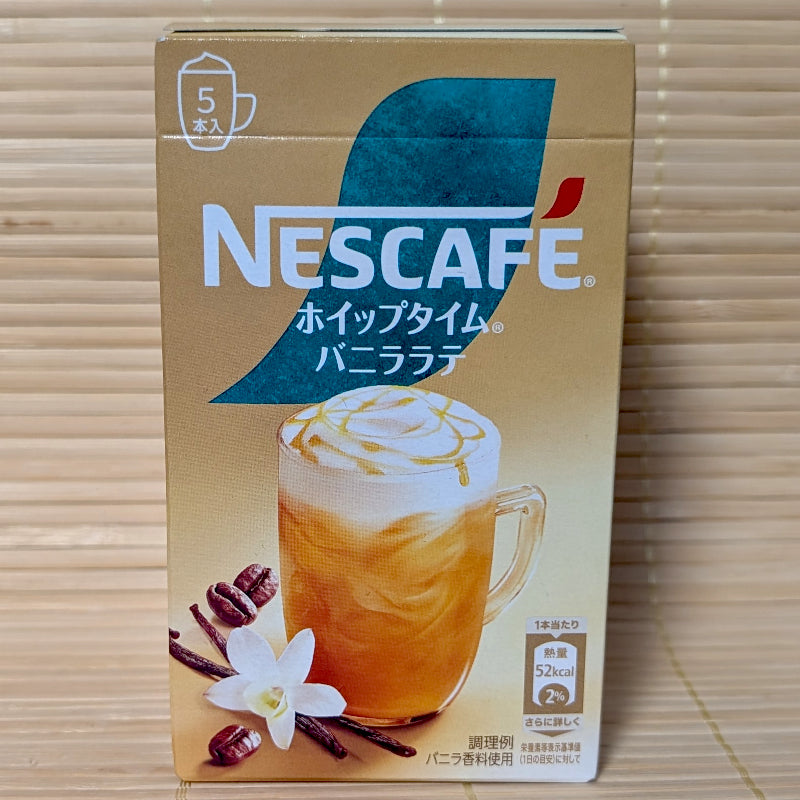 Gold and teal box of Nescafe Whip Time Vanilla Latte instant coffee sticks with a vanilla flower image.