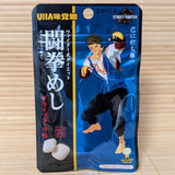 UHA Ninja Meishi gummy package featuring Street Fighter character on a tatami surface.