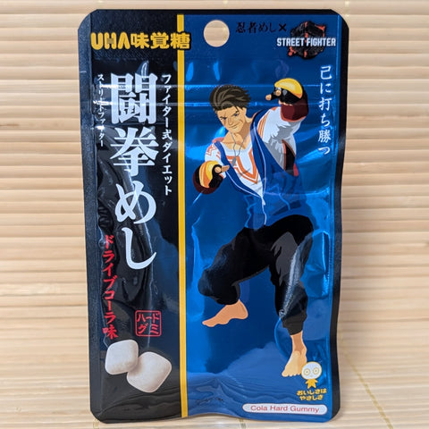 UHA Ninja Meishi gummy package featuring Street Fighter character on a tatami surface.