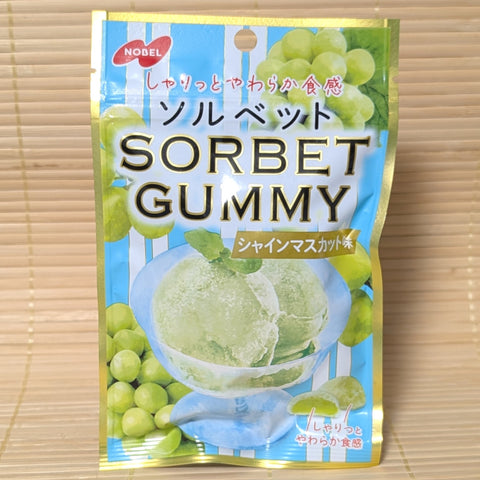 Packaging of Sorbet Gummy with green muscat grapes and ice cream image on a light wooden background