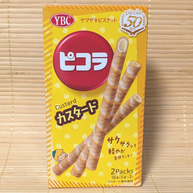 YBC Picolaa custard flavored wafer stick packaging on a wooden surface
