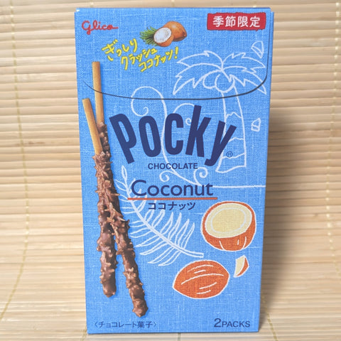 A light blue box of seasonal Glico Crunchy Coconut Pocky showing chocolate coated biscuit sticks covered in shredded coconut on a tatami background.