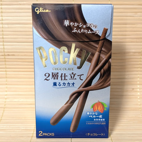 A box of Pocky Double Layer mousse style Cacao chocolate displayed on a wooden background