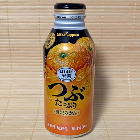 Aluminum bottle of Pokka Sapporo Tsubu Tappuri luxury orange drink with images of fresh mikan.