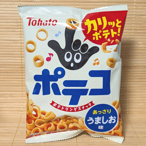 A white and red bag of Tohato Poteko Potato Ring Snack Light Salt with potato ring graphics on a bamboo background.   