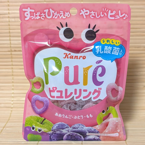 Pink package of Kano Pure fruit gummy ring candies on a tatami surface