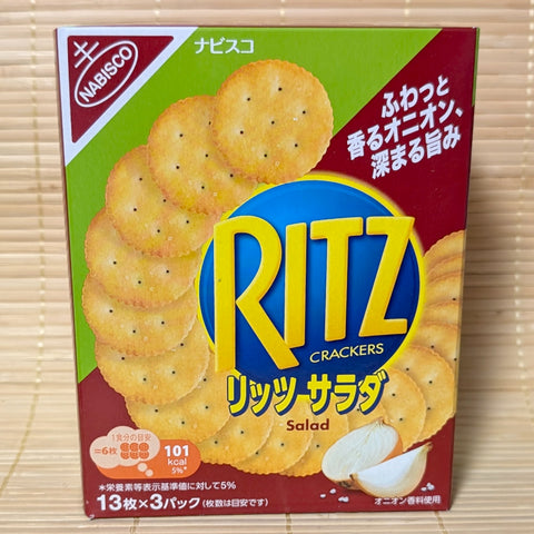 A green and red 128g box of Yamazaki Nabisco Ritz Salad Crackers displaying golden crackers and fresh onion graphics on a bamboo mat.