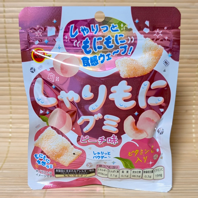 A pack of Sharimoni Peach Gummies displayed on a tatami background.