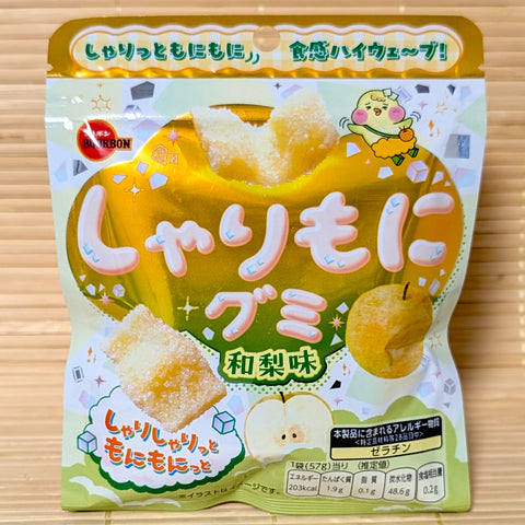 A light green and gold pouch of Sharimoni Japanese Nashi Pear Gummy showing sugar-dusted wavy gummies on a bamboo background.