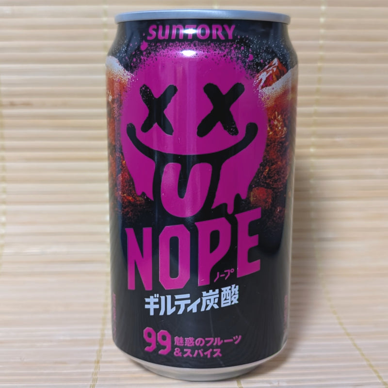 A black 340ml Suntory NOPE soda can with a vibrant neon pink smiley face graphic on a tatami background.