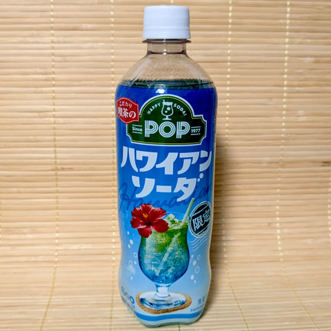 A 600ml bottle of blue Suntory POP Hawaiian Soda with a retro green logo and a red hibiscus flower graphic on a tatami background.