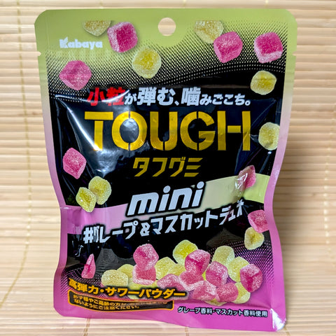 A slim purple pouch of Kabaya Tough Gummy Minis Grape Duo displayed on a traditional tatami background.