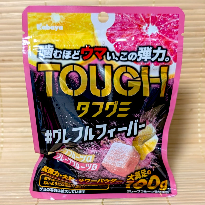 A pack of Kabaya TOUGH gummies featuring a double variety of Grapefruit flavors (both pink and yellow.) Displayed on a tatami background.