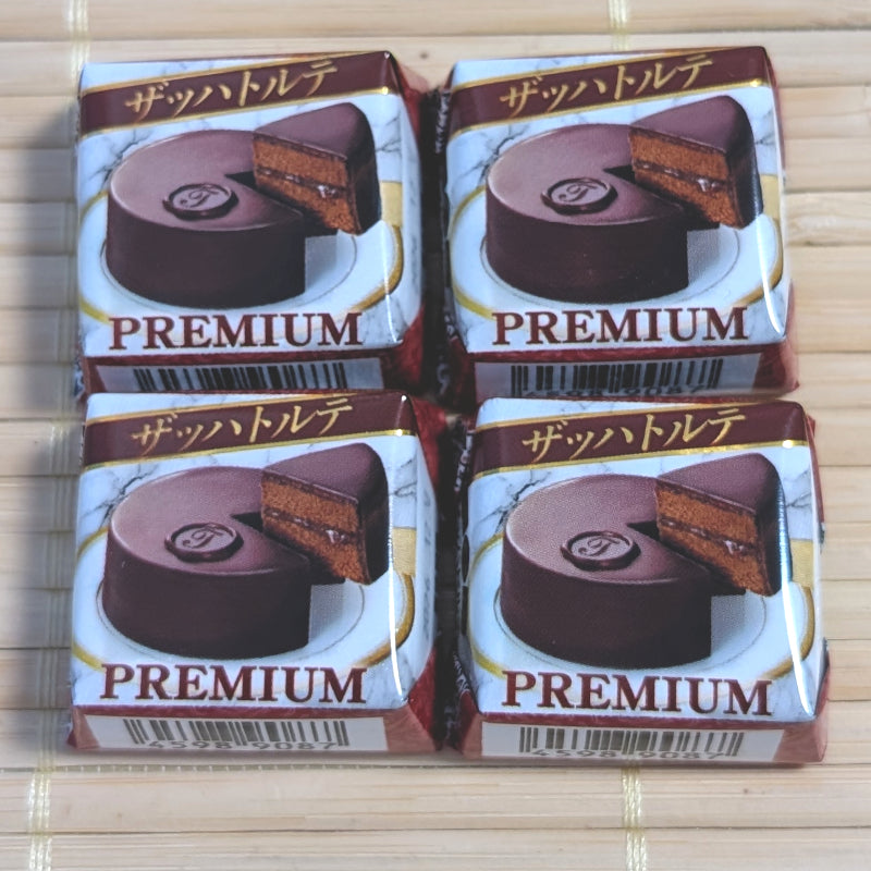 A 4-piece pack of Tirol Choco Chocolate Torte displayed on a traditional tatami background.