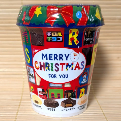 A Japanese Tirol chocolate tub with a Christmas-theme containing a mix of chocolate pieces. 34 individually wrapped chocolates inside. 
