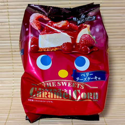 An elegant deep red bag of Tohato Caramel Corn The SWEETS Berry Cheesecake featuring a picture of the dessert.