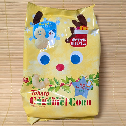 Packaging of seasonal winter White Milk flavored Tohato Caramel Corn on a wooden surface